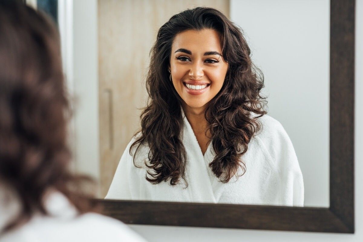 Smiling girl before getting braces treatment in dental clinic